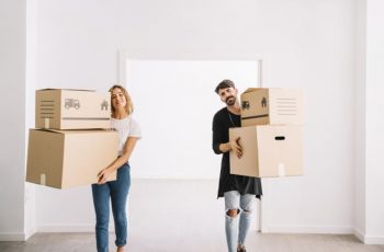 moving-with-couple-carrying-packages moving-with-couple-carrying-packages
